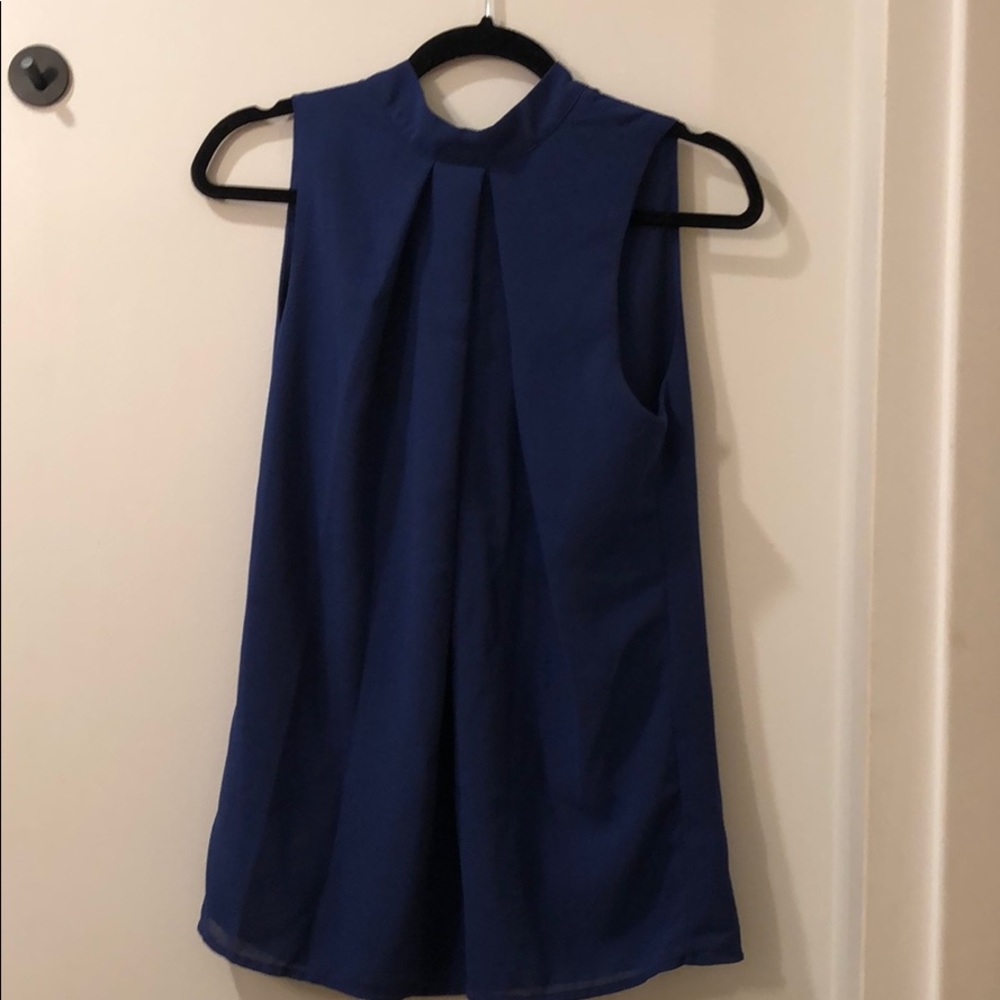 Blue blouse missing one/3 button on back of neck